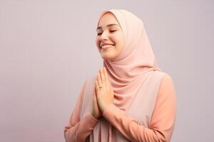AI generated Beautiful Asian Muslim woman with a radiant smile, making an Eid Mubarak greeting gesture, isolated on a clean background, representing the concept of religious lifestyle photo