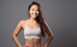 AI generated Beautiful Young Asian Woman Showcasing Strength and Determination in Dynamic Workout Poses, Fitness Session, Isolated Against a studio Background photo