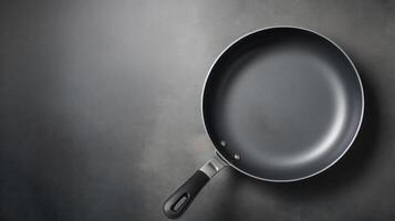 AI generated Empty black frying pan on black background. Copy space photo