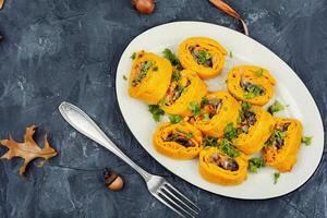 Pumpkin rolls with mushrooms photo