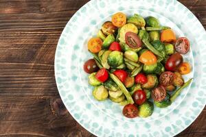 Vegetable salad with grilled brussel sprouts. photo