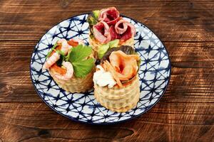 Tartlets with fish, shrimp and bacon. photo