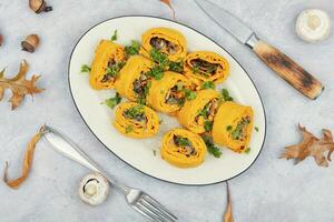 Pumpkin rolls with mushrooms photo