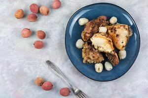 A plate of chicken roasted with lychee. photo