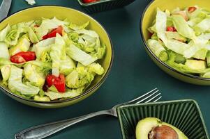 Healthy green salad with fresh vegetables. photo