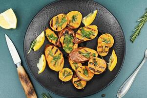 Grilled sweet potato, vegan food concept. photo