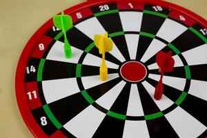 Darts in the target, safe dartboard with magnet for children, aiming at target to get points photo