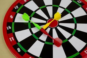 Magnetized darts on target for throwing, children game on the wall, scoring game for kids photo