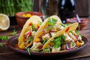 Mexican tacos with chicken meat, corn and salsa. Healthy tacos. Diet menu. Mexican taco. photo