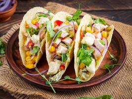 Mexican tacos with chicken meat, corn and salsa. Healthy tacos. Diet menu. Mexican taco. photo