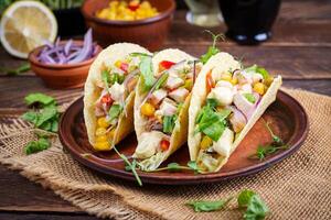 Mexican tacos with chicken meat, corn and salsa. Healthy tacos. Diet menu. Mexican taco. photo