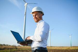 Power engineer are working with wind turbines. photo