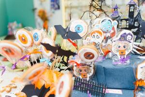 Funny delicious ginger biscuits for Halloween on the table. horizontal view from above photo