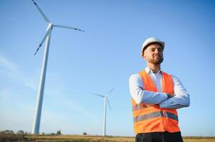 Businessmen engineering standing handsome smile front of turbine looking away photo