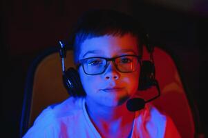 young man playing computer games on line photo