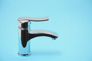 New chrome or steel mixer tap for bathroom sinks photo