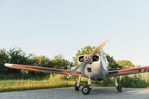 Portrait of a corporate jet on the runway against an evening sky. photo