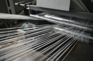 Production of polypropylene yarn for making bags. photo