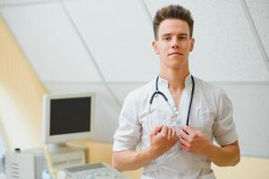 Portrait smiling doctor at office photo