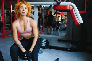 Close up image of attractive fit woman in gym photo
