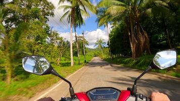 Riding a scooter on a tropical island in Thailand. POV video