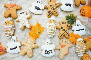 Funny delicious ginger biscuits for Halloween on the table. horizontal view from above photo