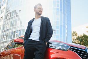 successful man near his car photo