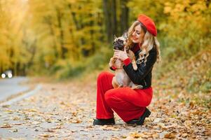 woman with dog walking in the park photo