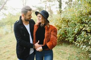 Romantic young couple in love relaxing outdoors in park. photo