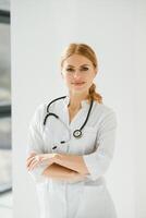 Portrait of happy successful female doctor. photo