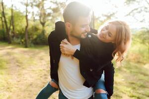 Romantic young couple in love relaxing outdoors in park. photo