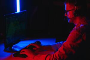 Handsome young male software developer programming codes while working from home photo