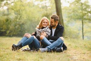 Romantic young couple in love relaxing outdoors in park. photo