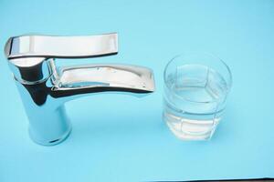 Double handle water tap. New chrome or steel mixer tap photo