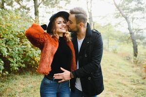 Romantic young couple in love relaxing outdoors in park. photo