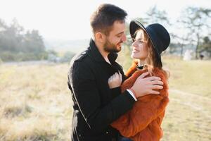 Romantic young couple in love relaxing outdoors in park. photo