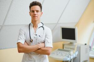 good looking male medical nurse with stethoscope photo