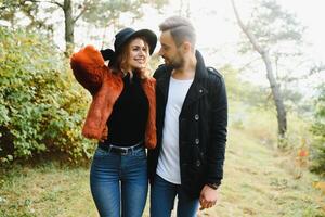 Romantic young couple in love relaxing outdoors in park. photo