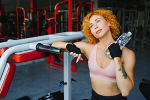 Close up image of attractive fit woman in gym photo