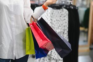 Woman with shopping bags in shop photo