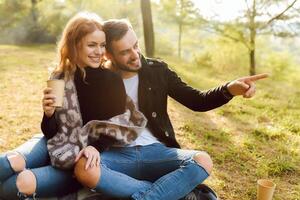 Romantic young couple in love relaxing outdoors in park. photo