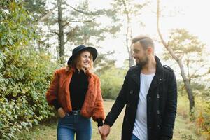 Romantic young couple in love relaxing outdoors in park. photo