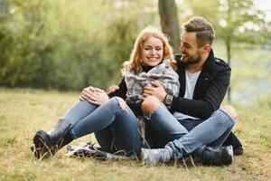 Romantic young couple in love relaxing outdoors in park. photo