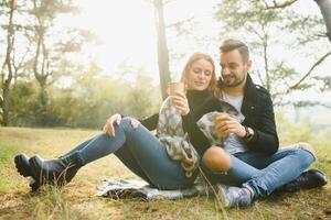 Romantic young couple in love relaxing outdoors in park. photo