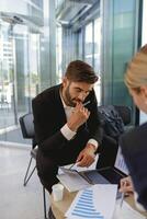 Two business colleagues have meeting in cafe to solve biz issues. Distance work concept photo