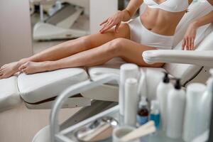 Cropped shot of body of woman ready for hair removal, skin treatment at spa beauty center photo
