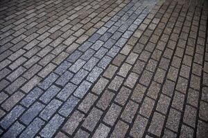 Old wet cobblestone floor photo