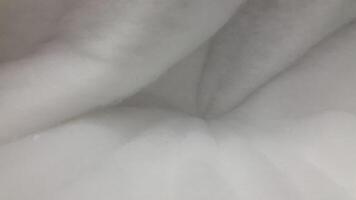 Fluffy texture. Soft white fluffy surface. Fuzzy background photo