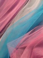 Thin cloth. Thin translucent colored fabric. Fabric background photo