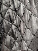 Raincoat fabric. Stitched raincoat fabric. Background with raincoat fabric photo